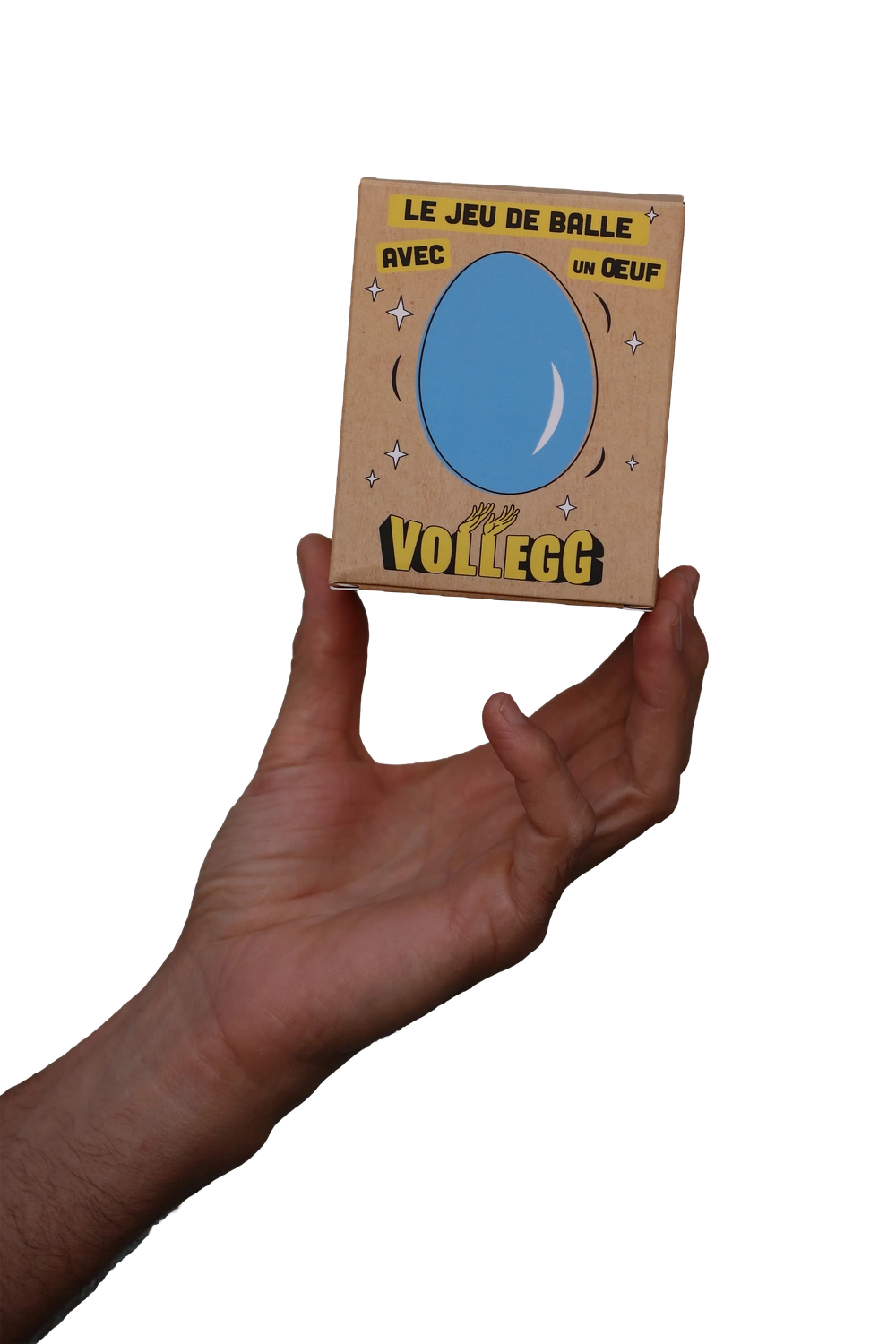 Une main tient la boîte Vollegg.